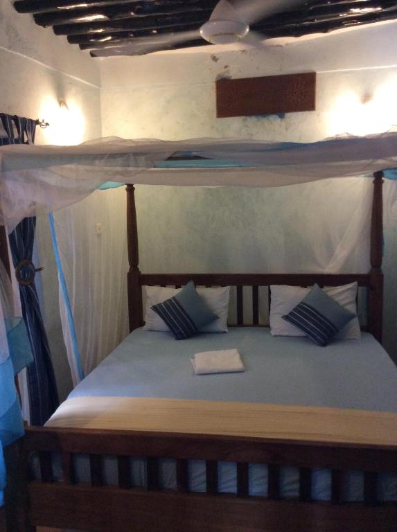 Postel nebo postele na pokoji v ubytování Kiponda B&B