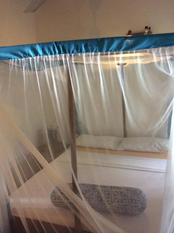 Postel nebo postele na pokoji v ubytování Kiponda B&B