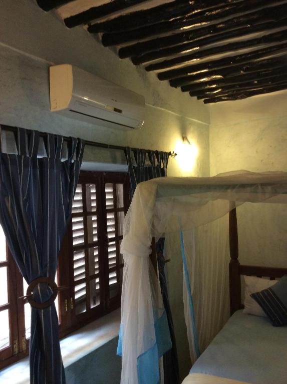 Postel nebo postele na pokoji v ubytování Kiponda B&B