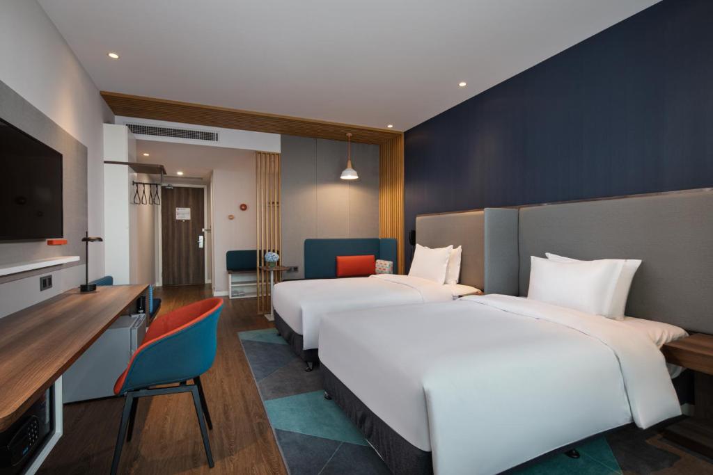 Postel nebo postele na pokoji v ubytování Holiday Inn Express Langfang New Chaoyang by IHG