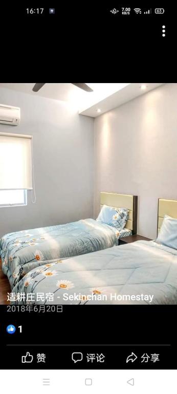 Postel nebo postele na pokoji v ubytování Sekinchan HighLevel SeaView Homestay 高楼 看海 阳台民宿