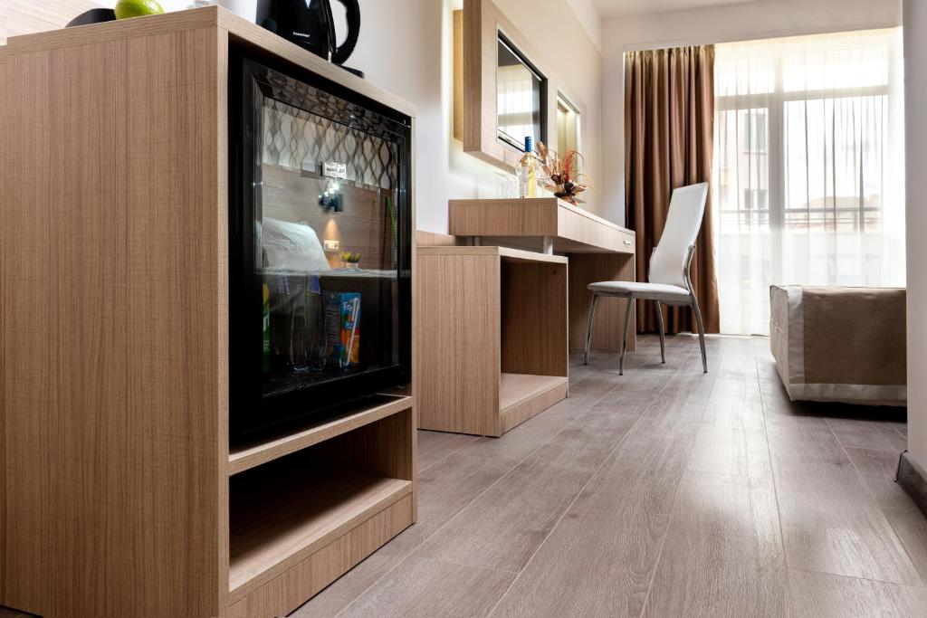 A television and/or entertainment centre at Maria Palace Hotel - All Inclusive