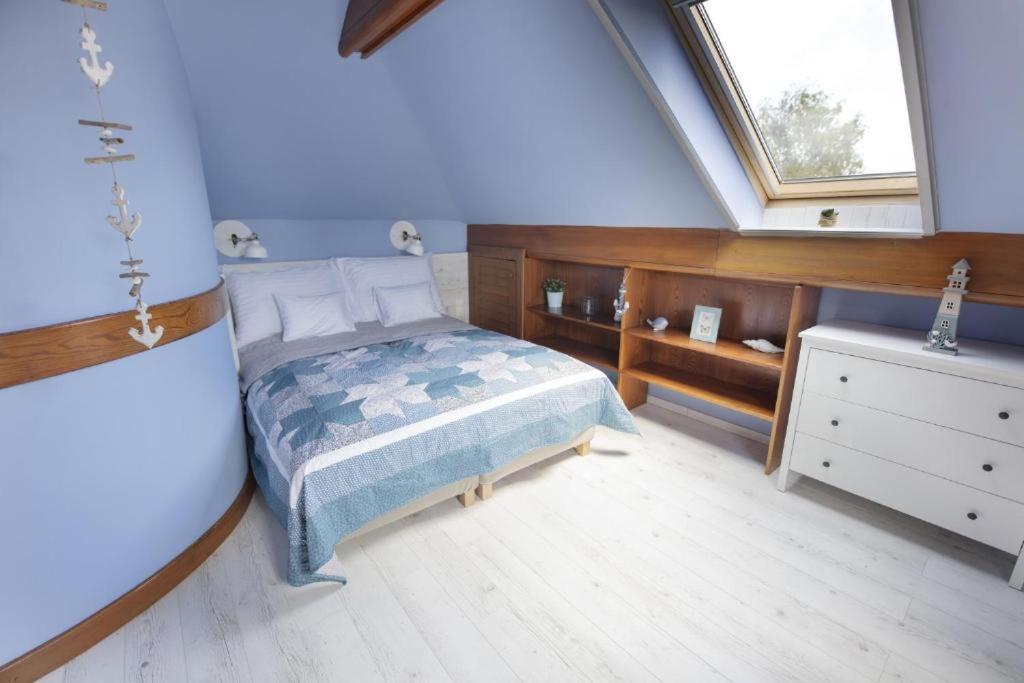 Posteľ alebo postele v izbe v ubytovaní TópART Apartman I