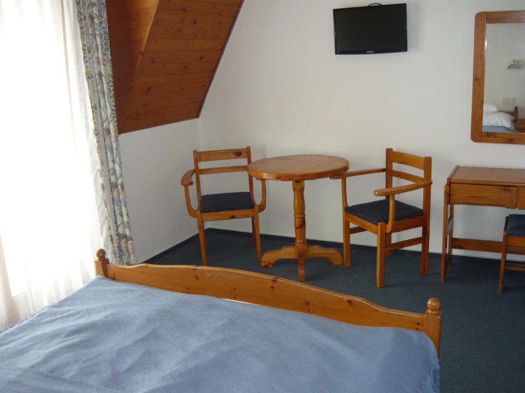 Postel nebo postele na pokoji v ubytování Wellness Hotel Kakadu