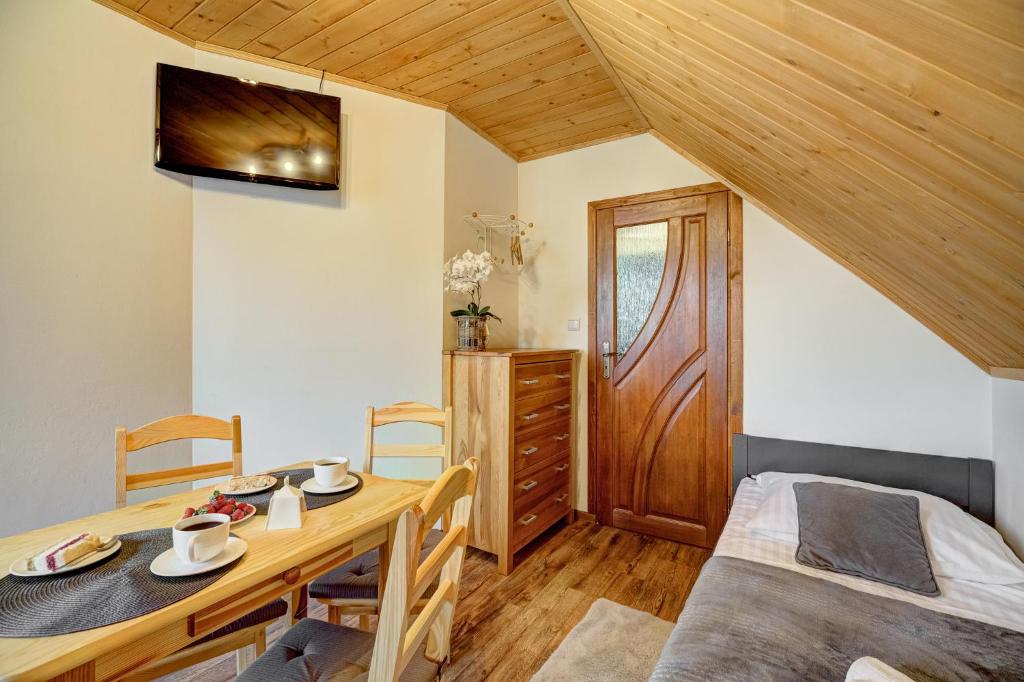 Postel nebo postele na pokoji v ubytování Apartamenty Szwarcowa