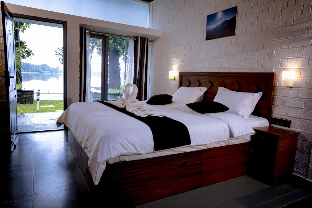 Postel nebo postele na pokoji v ubytování S RIVER RESORTS