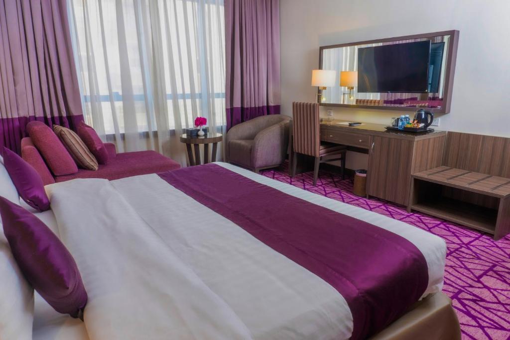 Postel nebo postele na pokoji v ubytování Aquila ALdiafah Hotel
