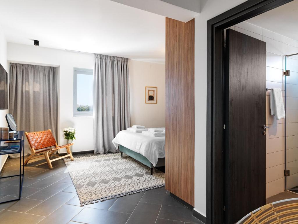 Postel nebo postele na pokoji v ubytování LIV URBAN Suites