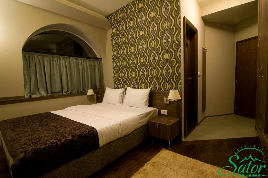 Postel nebo postele na pokoji v ubytování Hotel Šator