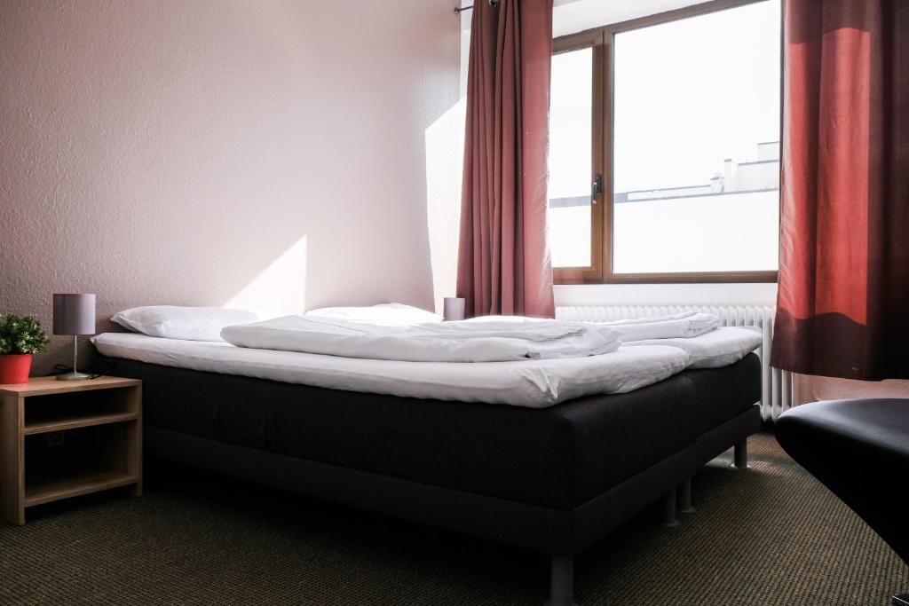 Uma cama ou camas num quarto em Hammerbrook Hostel
