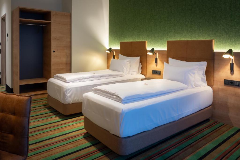 Voodi või voodid majutusasutuse Kb Hotel toas