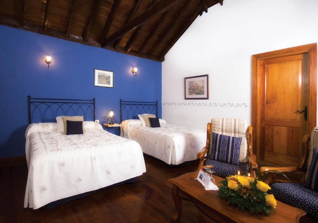 Postel nebo postele na pokoji v ubytování Hotel Rural Senderos de Abona
