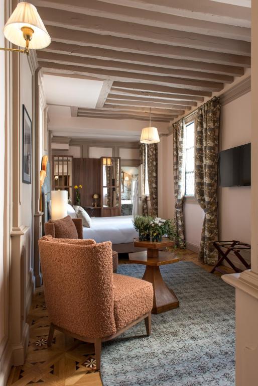 Postel nebo postele na pokoji v ubytování Hôtel Fougère