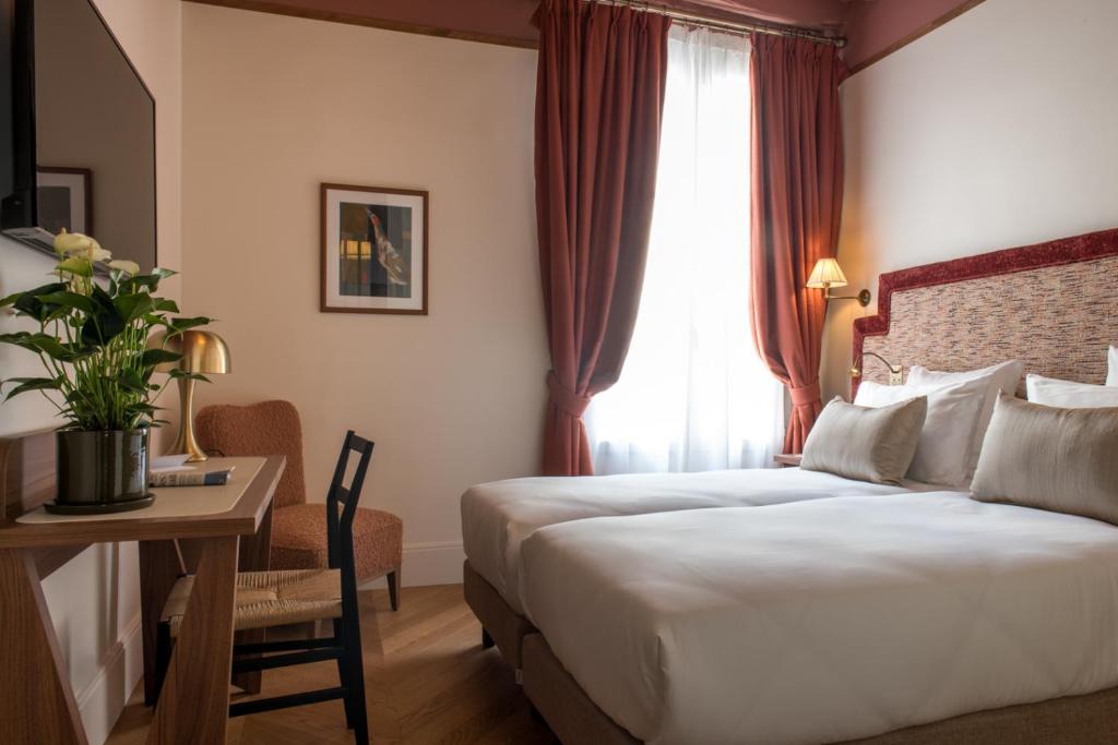 Postel nebo postele na pokoji v ubytování Hôtel Fougère