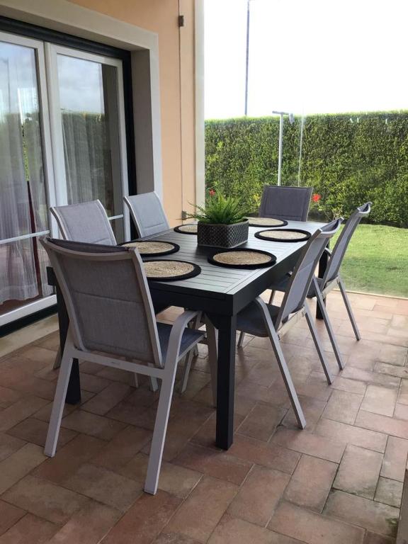 a black table and chairs on a patio at Casa da Praia in Sagres