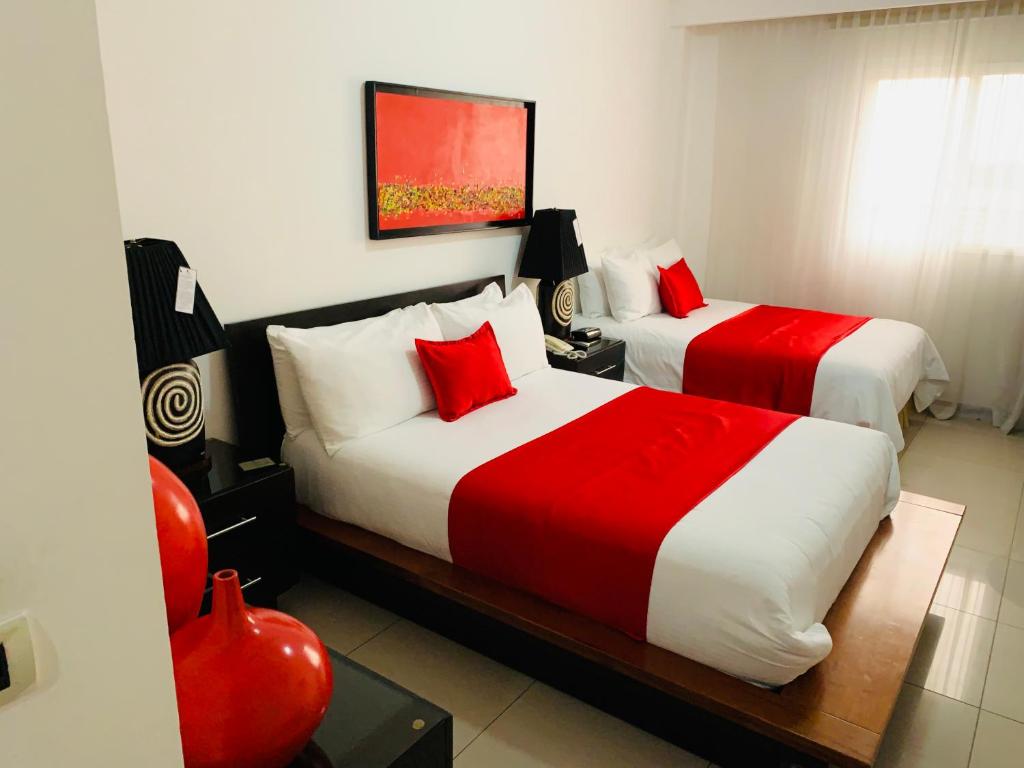 Postel nebo postele na pokoji v ubytování Hotel Galerias HN