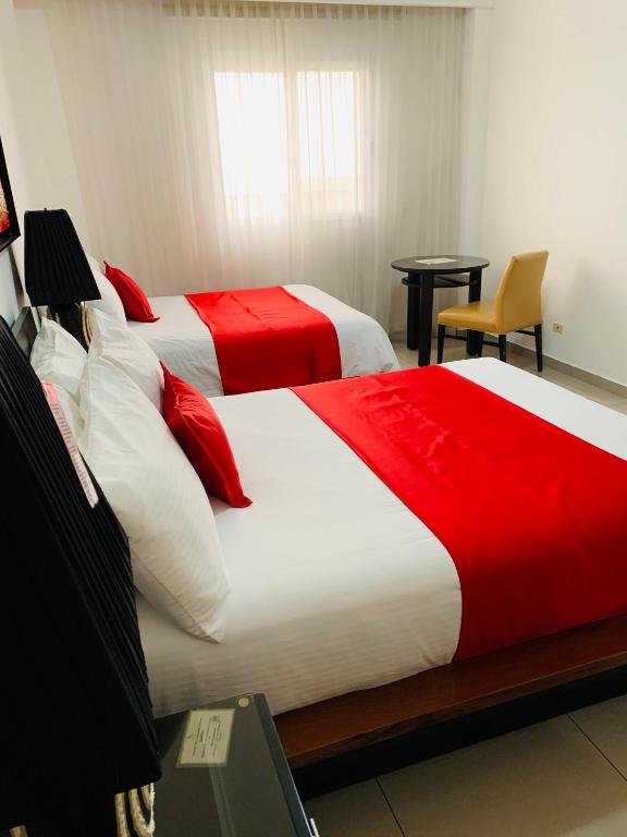 Postel nebo postele na pokoji v ubytování Hotel Galerias HN