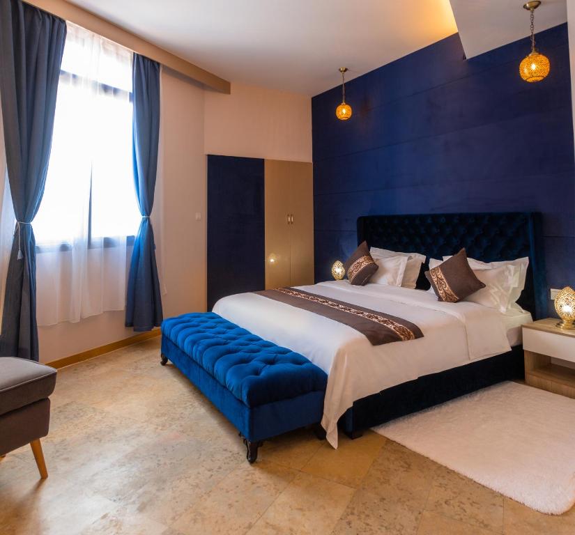 Postel nebo postele na pokoji v ubytování VANCII Hotel