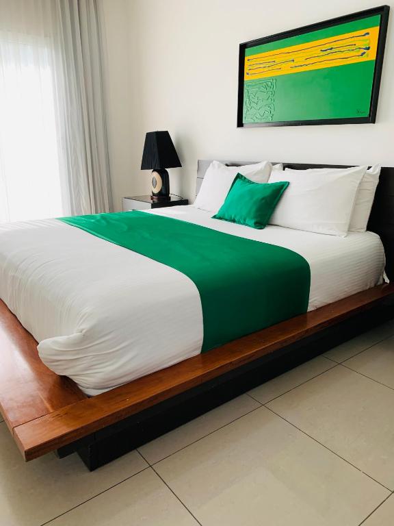 Postel nebo postele na pokoji v ubytování Hotel Galerias HN
