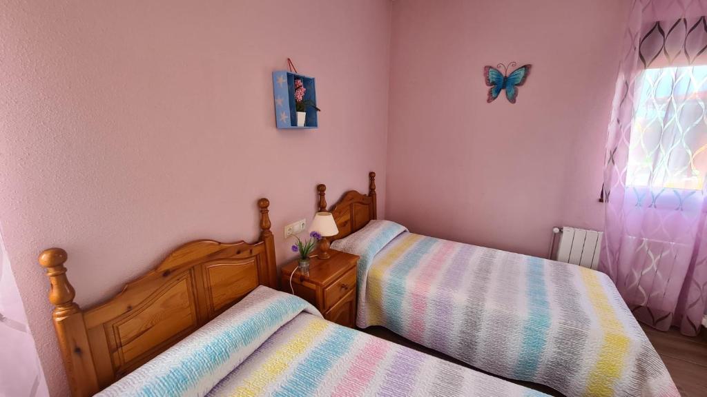 Postel nebo postele na pokoji v ubytování El BurbyI