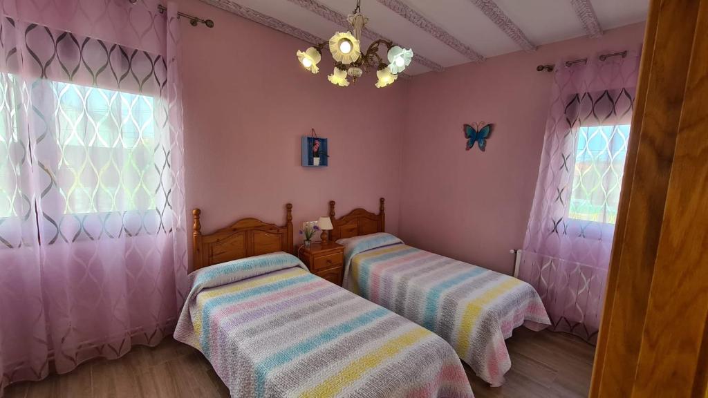 Postel nebo postele na pokoji v ubytování El BurbyI