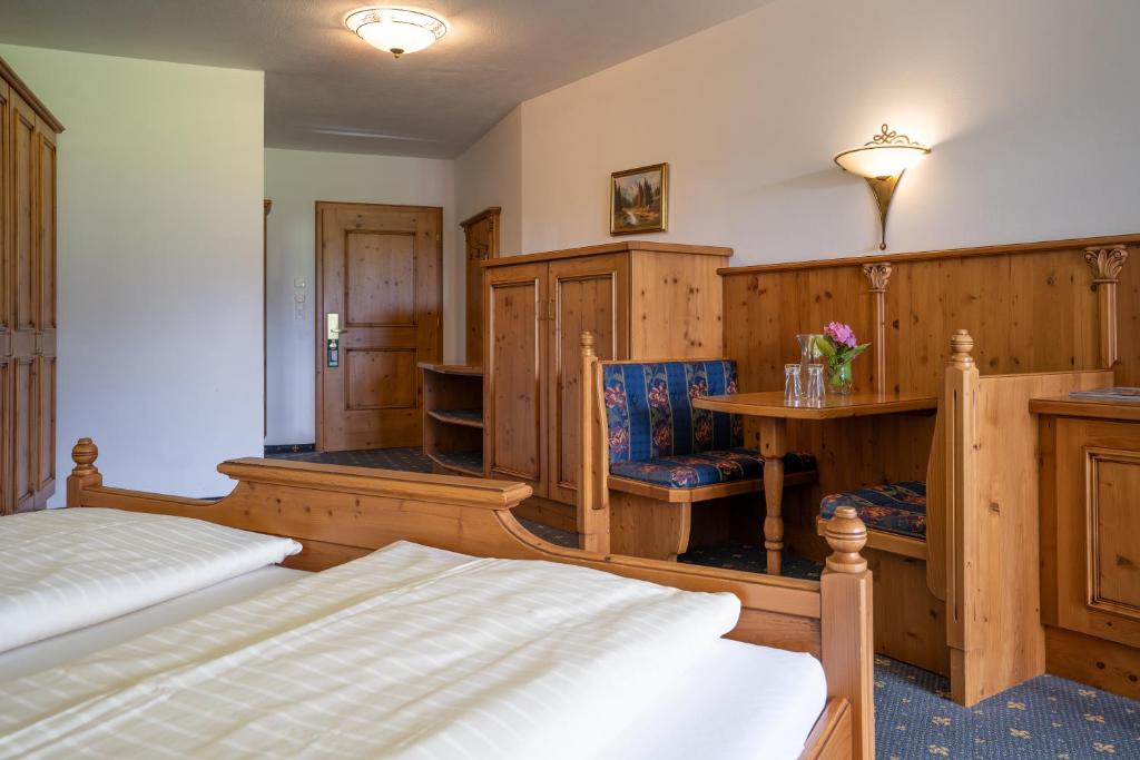 Postel nebo postele na pokoji v ubytování Posthotel Erlerwirt