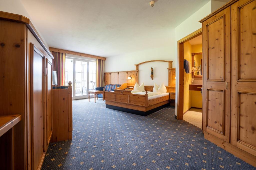 Postel nebo postele na pokoji v ubytování Posthotel Erlerwirt