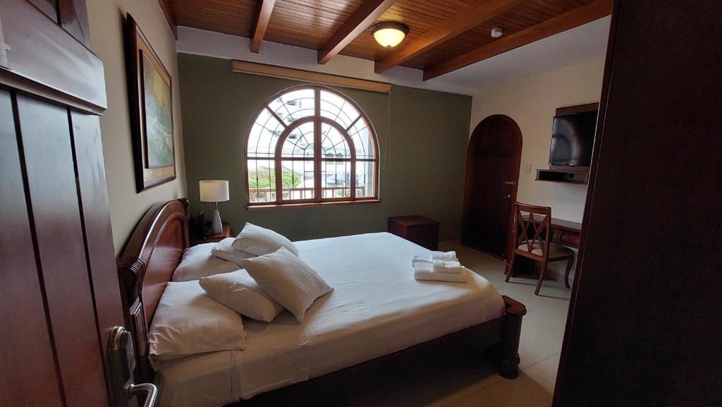 Postel nebo postele na pokoji v ubytování Hotel Voyager Manta