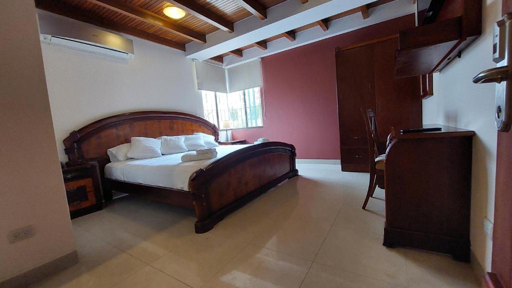 Postel nebo postele na pokoji v ubytování Hotel Voyager Manta