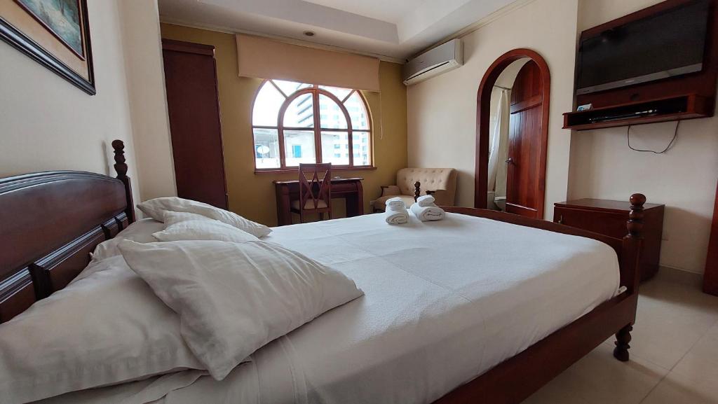Postel nebo postele na pokoji v ubytování Hotel Voyager Manta