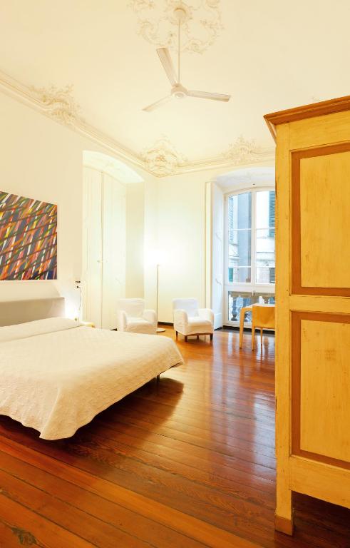 A bed or beds in a room at Palazzo Cicala