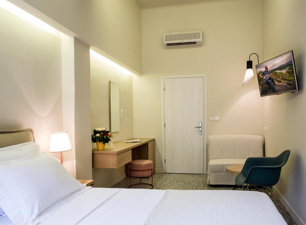 Postel nebo postele na pokoji v ubytování Athena hotel