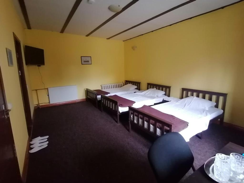 Postel nebo postele na pokoji v ubytování Pensiunea Casa Benko