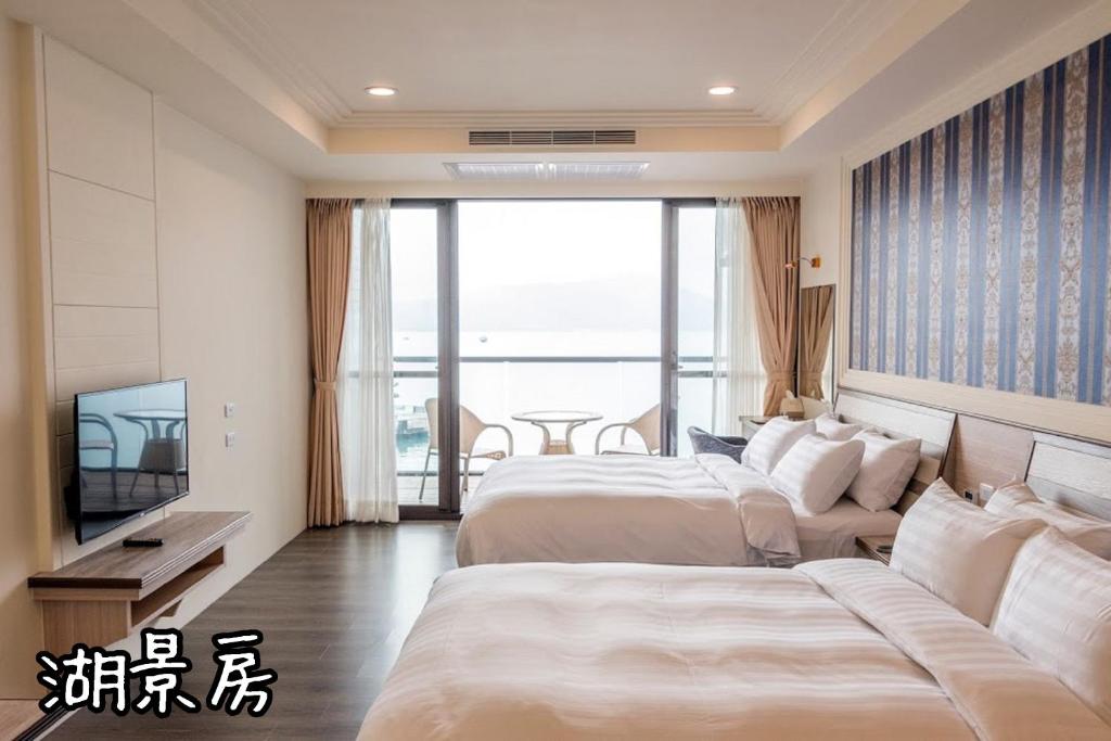 Postel nebo postele na pokoji v ubytování Shang Shan Ting Chao Hotel