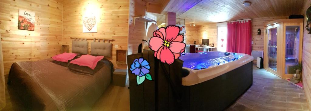 łazienka z wanną i łóżko w pokoju w obiekcie AUBRAC Spa w mieście Saint-Chély-dʼAubrac