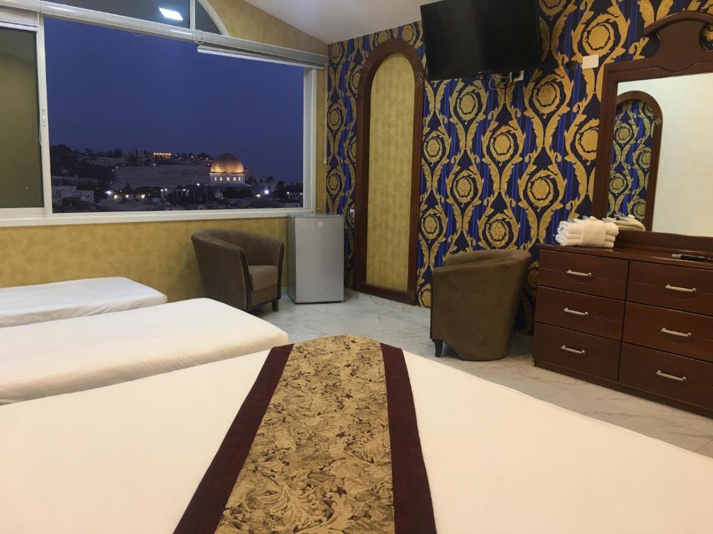 Postel nebo postele na pokoji v ubytování Hashimi Hotel