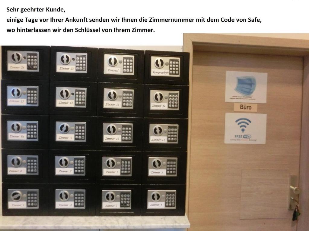 a room with a door with stickers on it at Pension Stadtpark in Hamburg