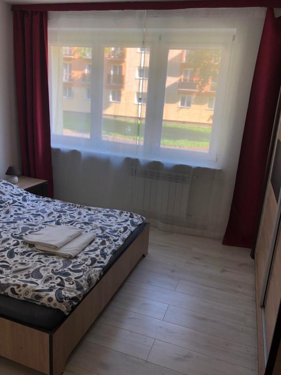 Posteľ alebo postele v izbe v ubytovaní Apartment Mona Warsaw przy stacji metra