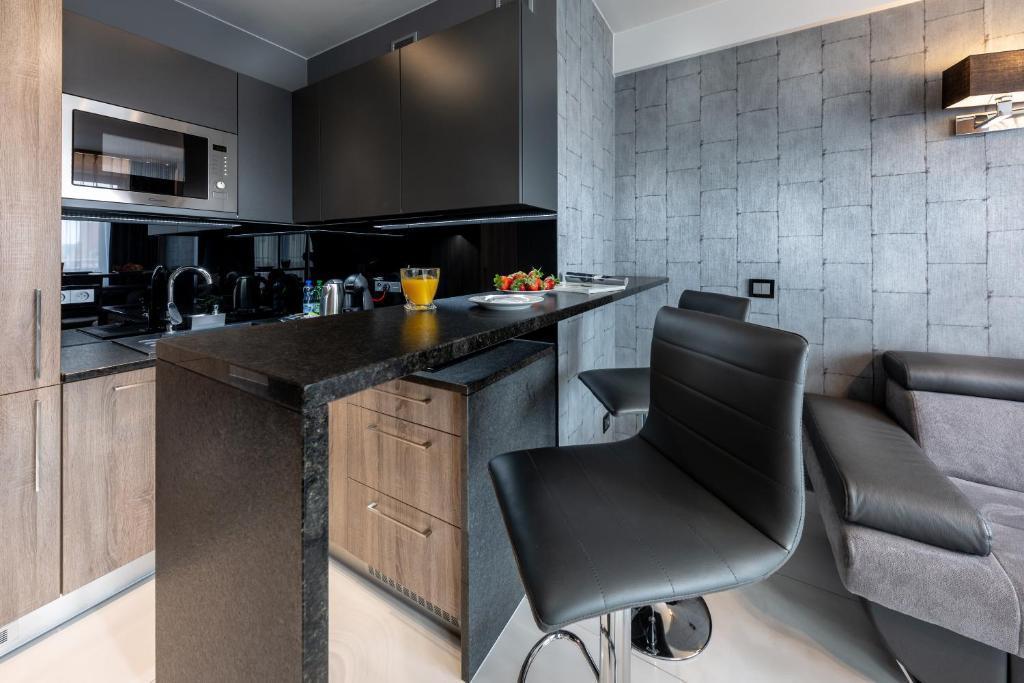 Kuchyň nebo kuchyňský kout v ubytování Aparthotel New Lux