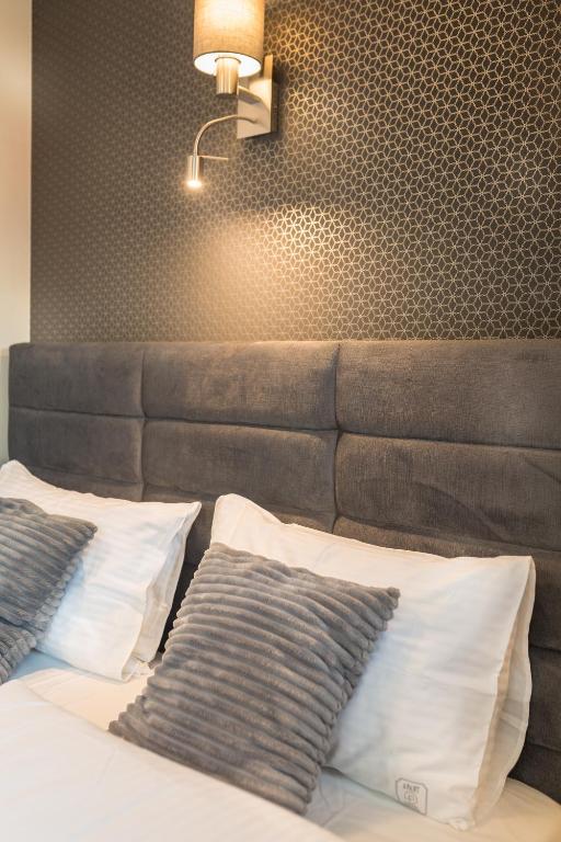 Postel nebo postele na pokoji v ubytování Aparthotel New Lux