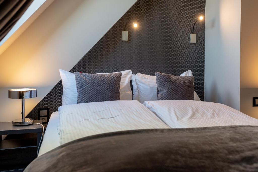 Postel nebo postele na pokoji v ubytování Aparthotel New Lux