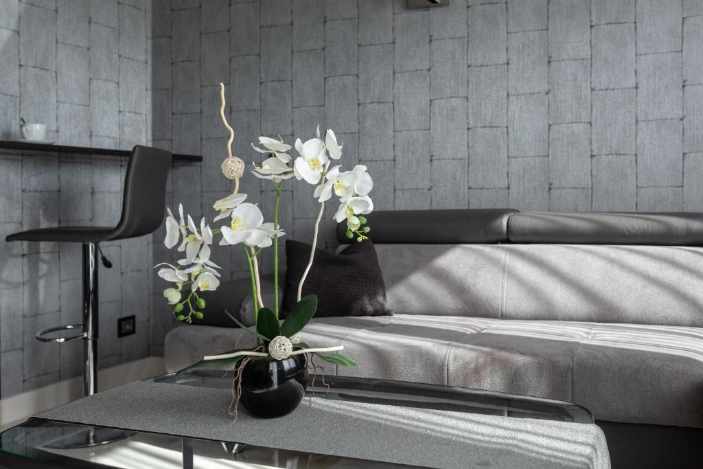Postel nebo postele na pokoji v ubytování Aparthotel New Lux