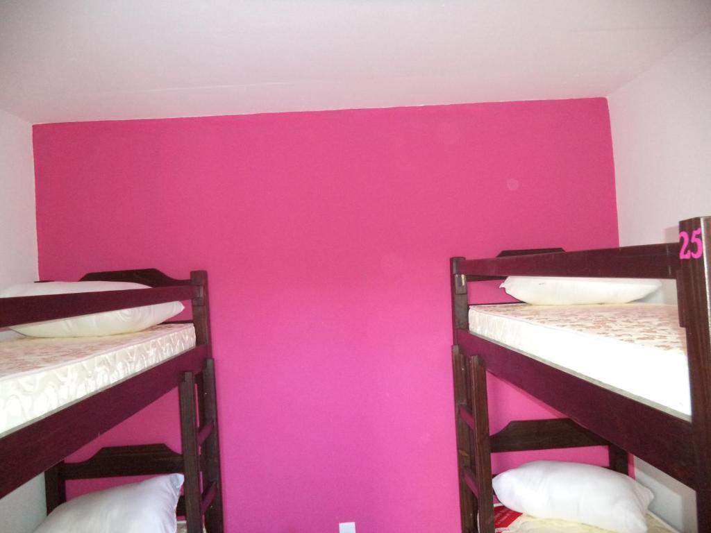 Postel nebo postele na pokoji v ubytování Hostel de los Colores