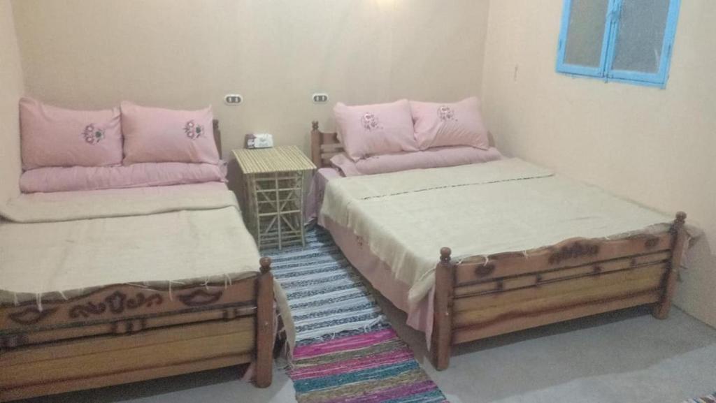Postel nebo postele na pokoji v ubytování Olive Garden House Siwa