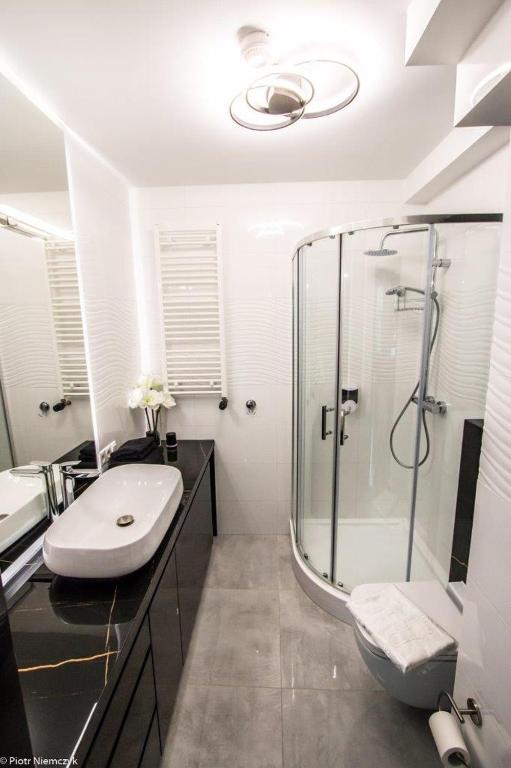 Kúpeľňa v ubytovaní Apartament Unia 12 Basen&SPA