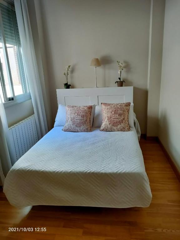 Posteľ alebo postele v izbe v ubytovaní Apartamento Nueva del Santísimo