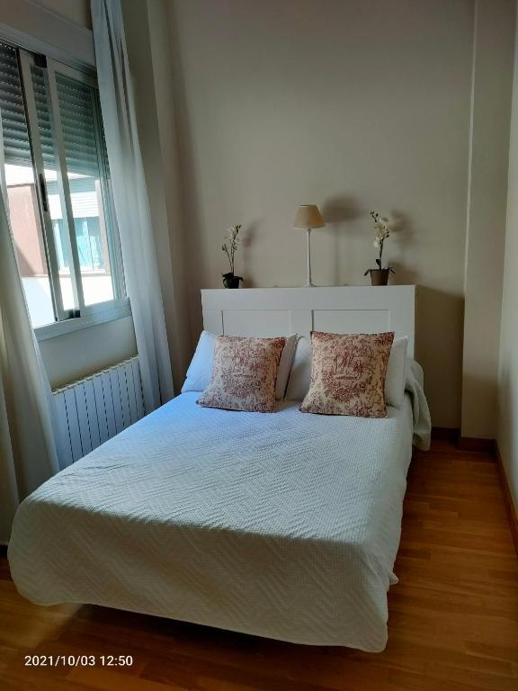 Posteľ alebo postele v izbe v ubytovaní Apartamento Nueva del Santísimo