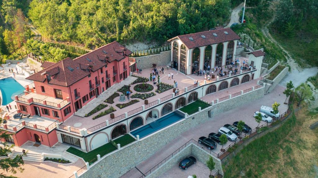 an aerial view of a large building with a pool at Nordelaia in Cremolino