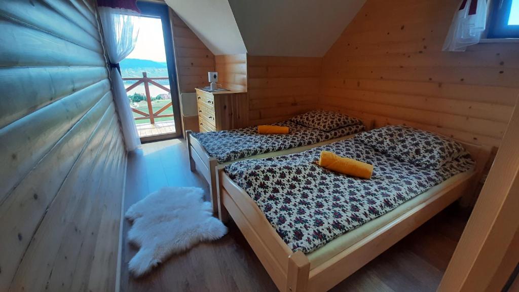Posteľ alebo postele v izbe v ubytovaní Podhalańskie Domki u Magdusi i Marcina z Jacuzzi