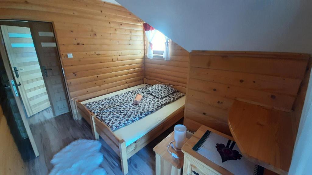Posteľ alebo postele v izbe v ubytovaní Podhalańskie Domki u Magdusi i Marcina z Jacuzzi